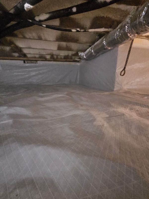 Reinforced white liner covering a crawl space floor and walls
